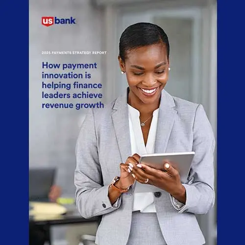 Business woman looking at payments information on her tablet