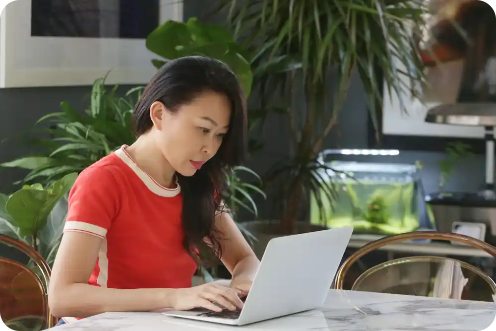 A woman using a laptop computer.