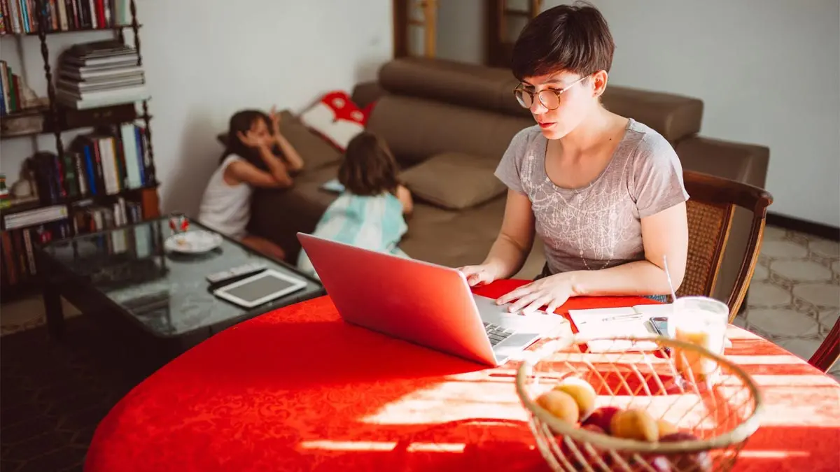 Woman using laptop computer.
