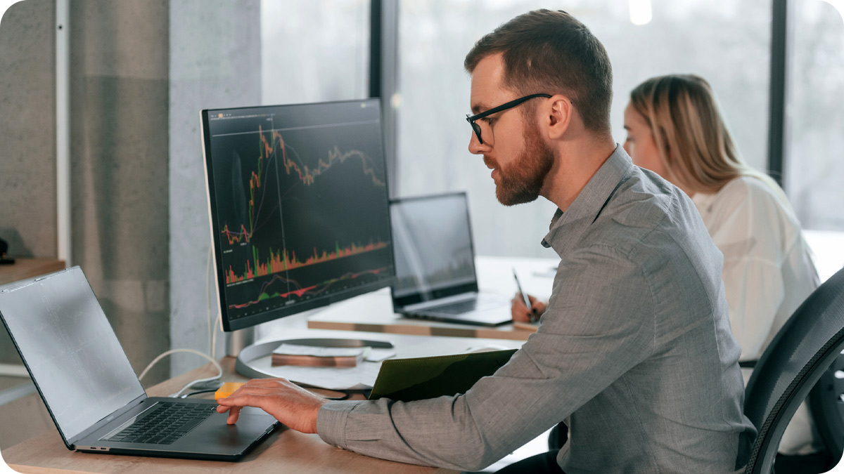 Two people working in an office environment.