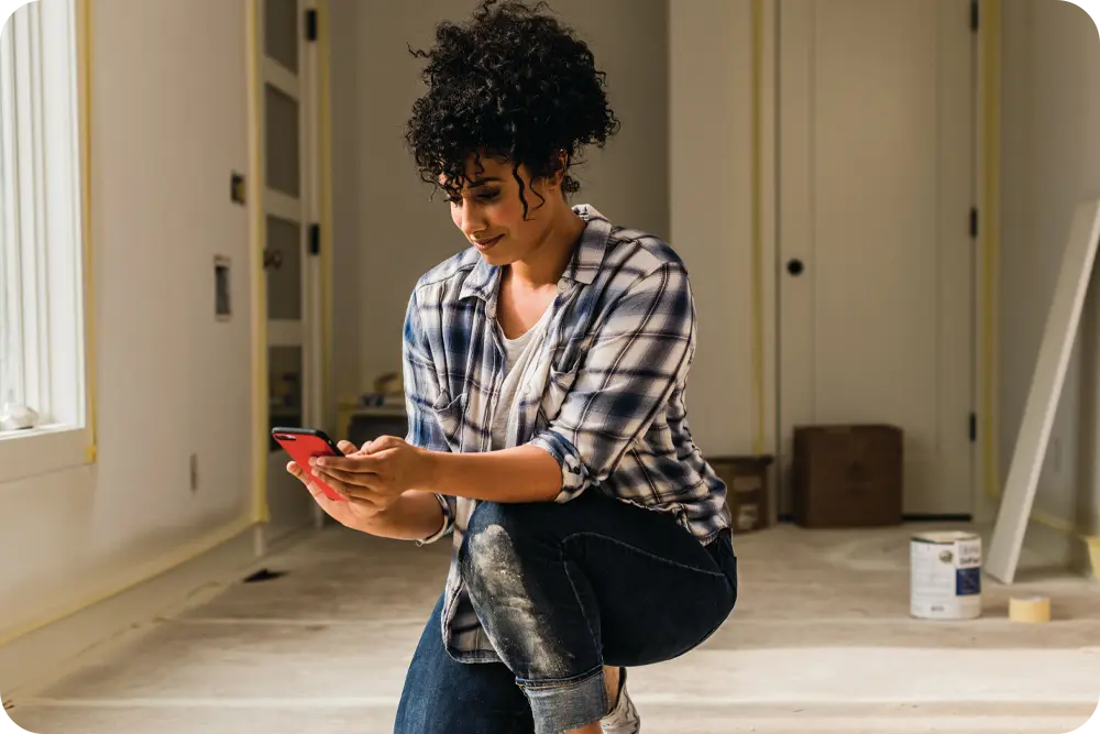 A woman doing construction on her house
