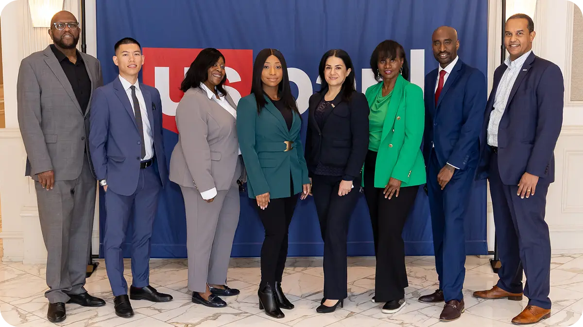 A group of people standing together and facing the camera.