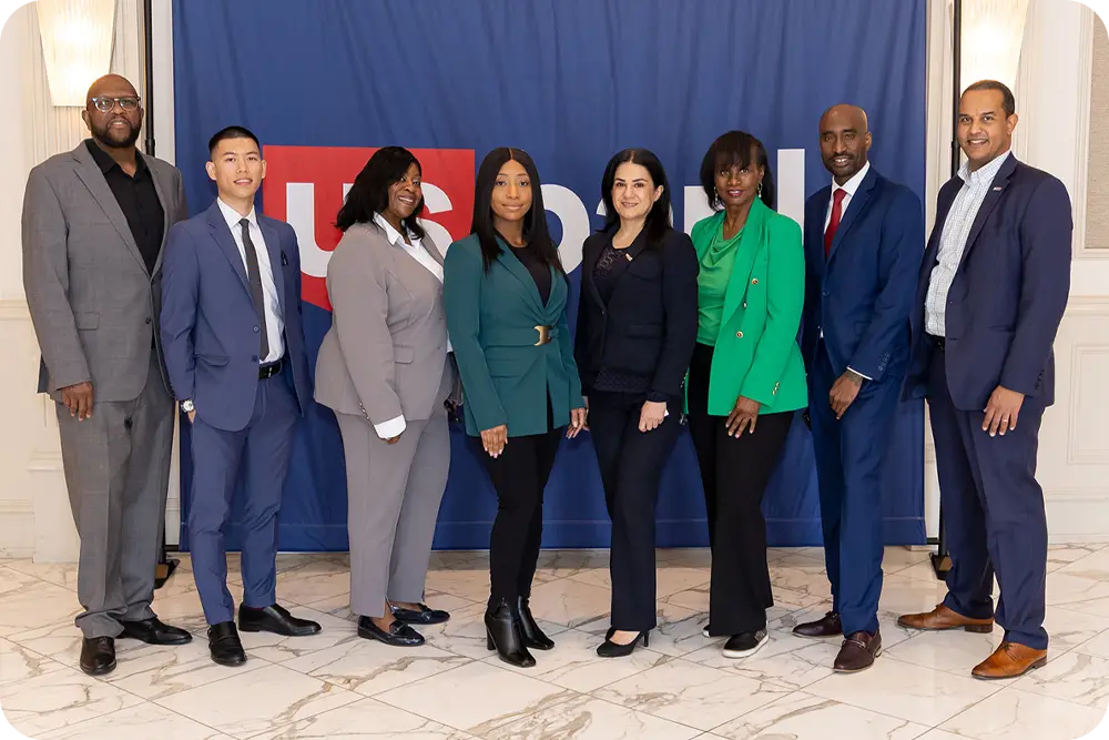 A group of people standing together and facing the camera.
