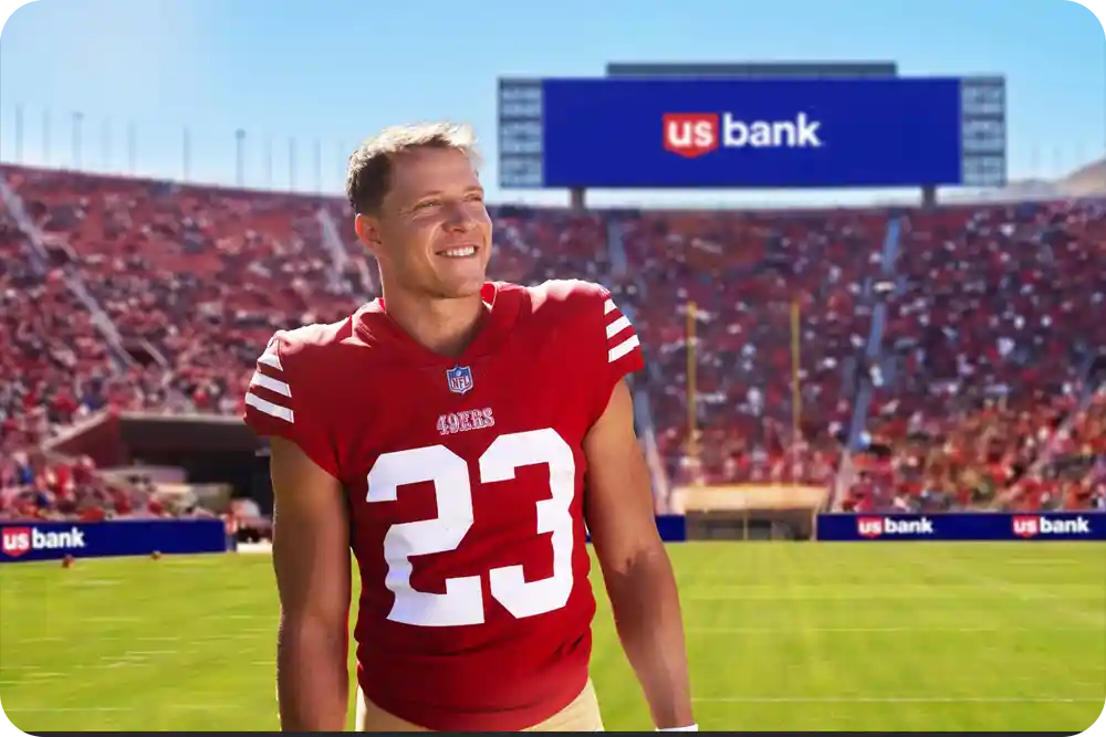 A man in a football uniform inside a football stadium.