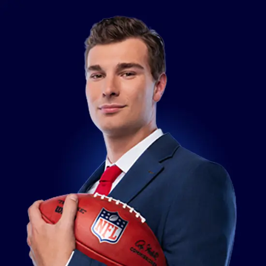 Fernando Mendoza, wearing a suit and holding a football