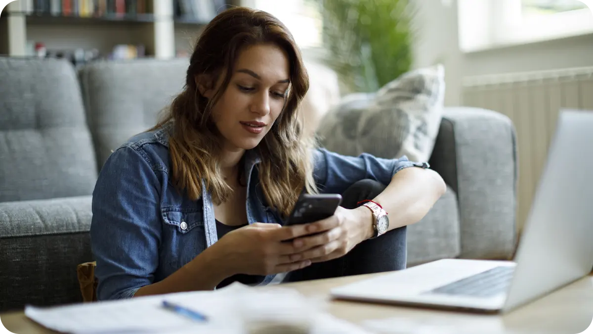 A woman using her mobile phone.