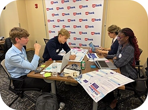 Group of students working together at a table.