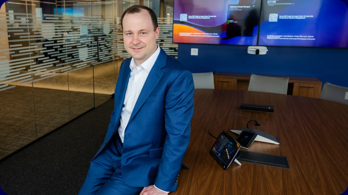 A man in a bank office setting.