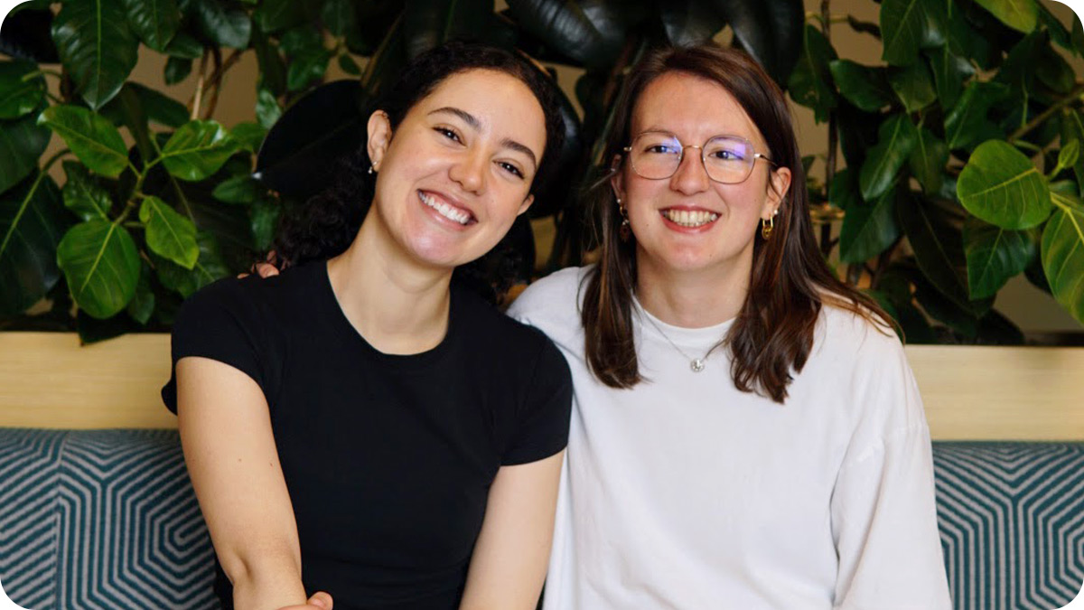 Two women seated side by side and facing the camera.