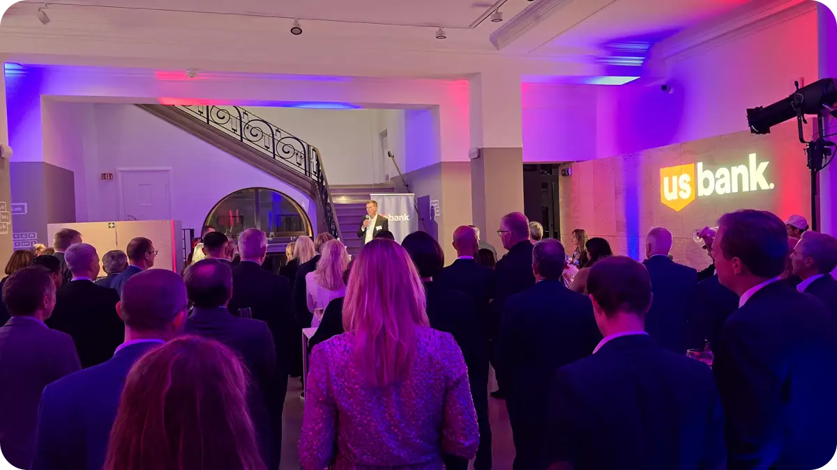 People watching someone at a party deliver a speech