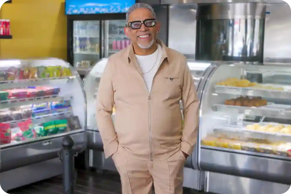 Man behind a bakery counter