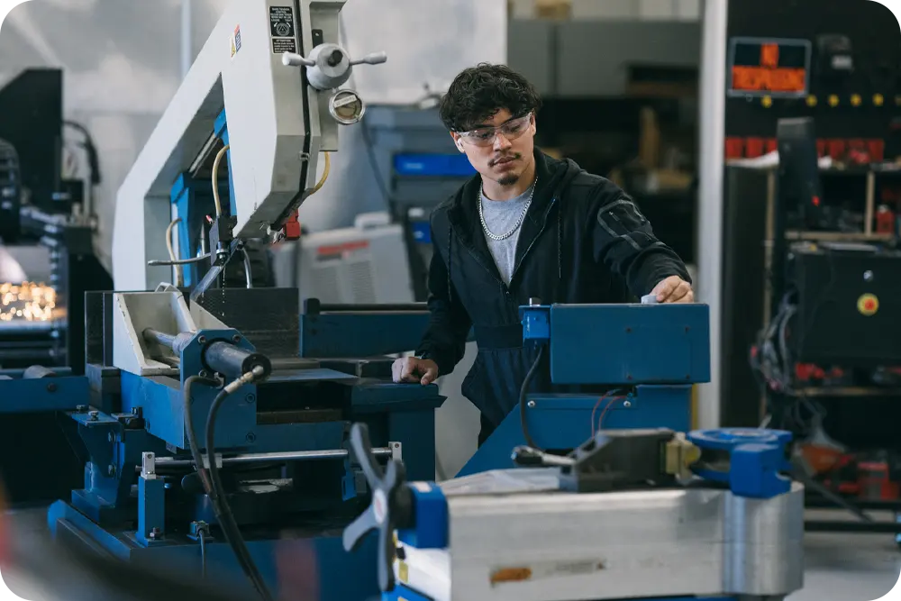 A man working in an industrial setting.