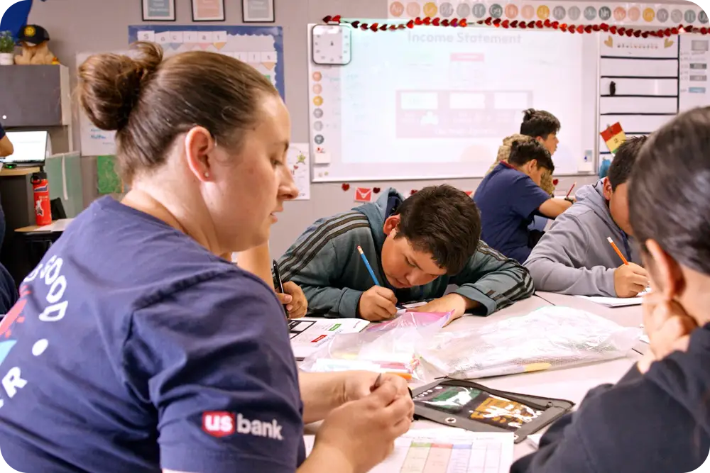 A classroom with adults and children.