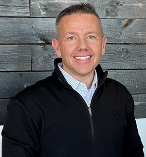 Man standing and facing the camera