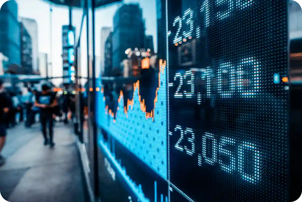 A stock ticker display on a city street.