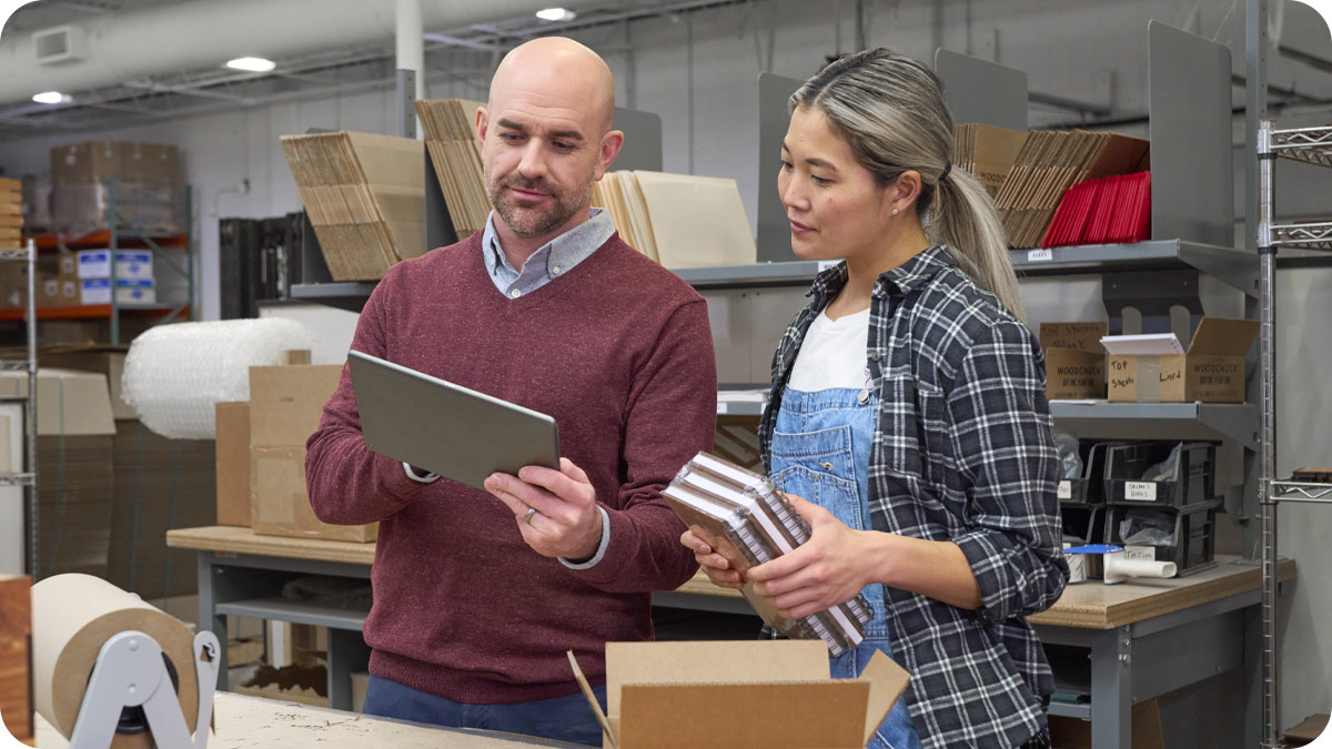A man and woman in a small business setting.