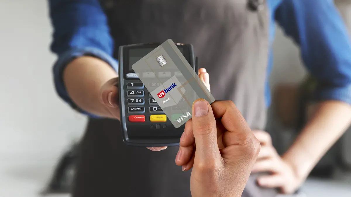 Waiter with payment terminal in cafe, closeup