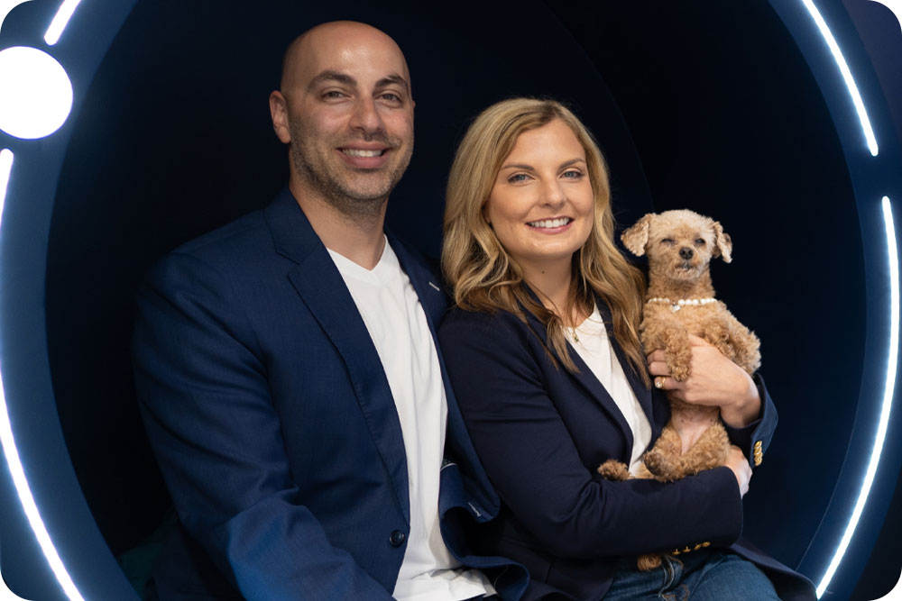 A man and woman with a dog.