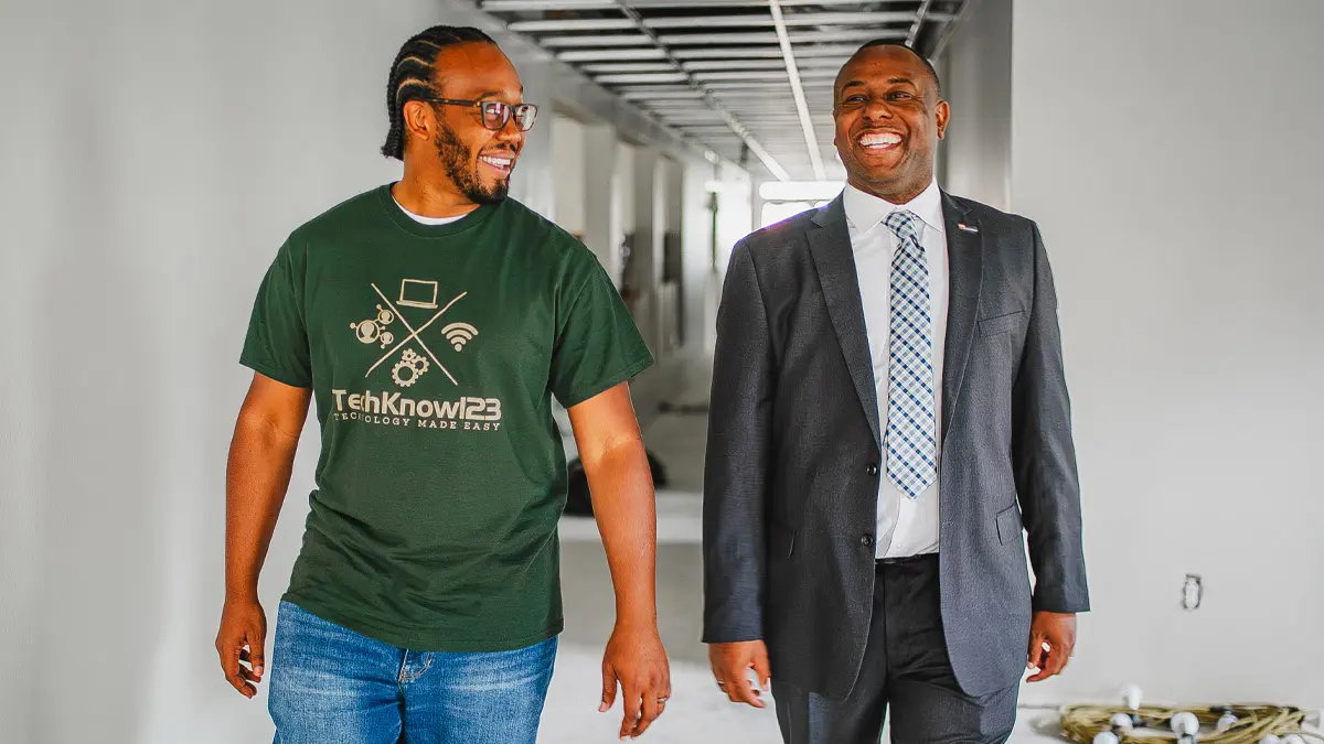 Two men walking together.