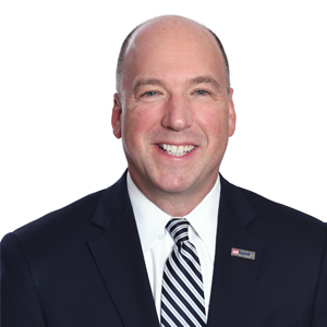 Headshot of a man in a suit