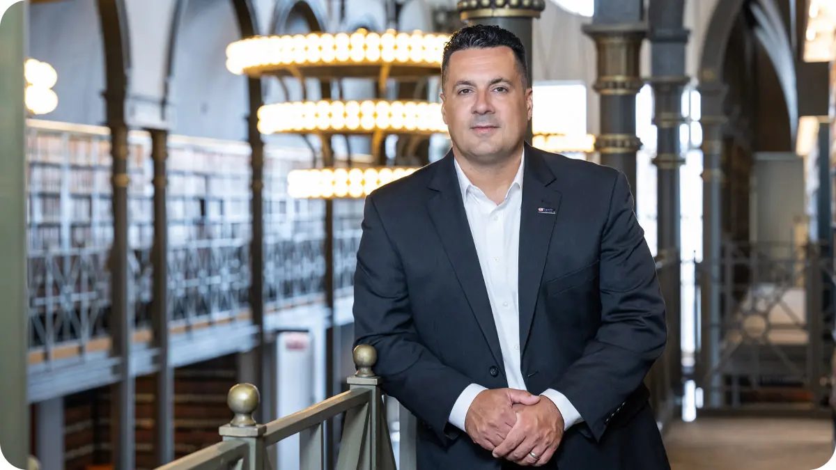 Man standing and facing the camera.