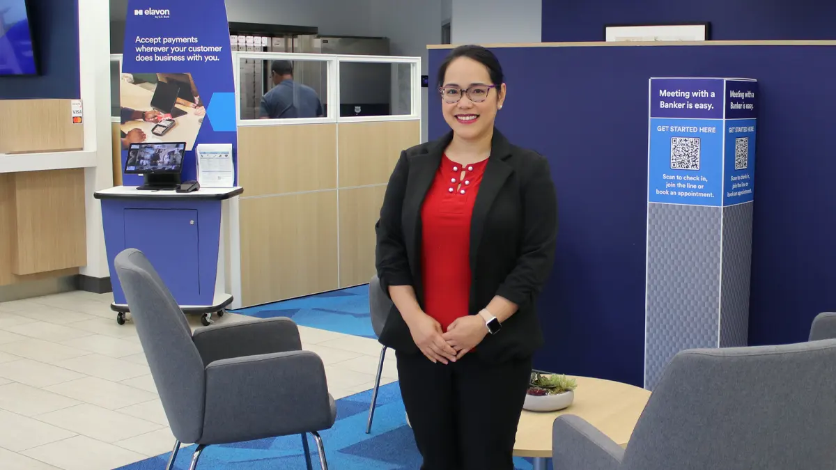 A woman in a bank office setting.