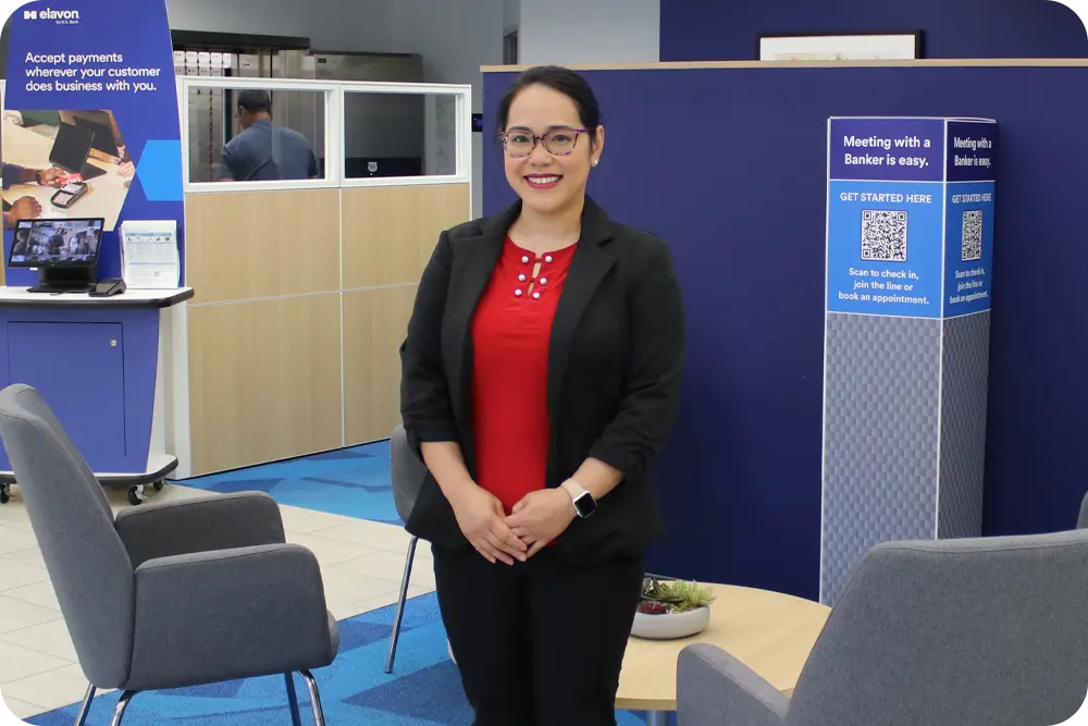 A woman standing in a U.S. Bank branch.