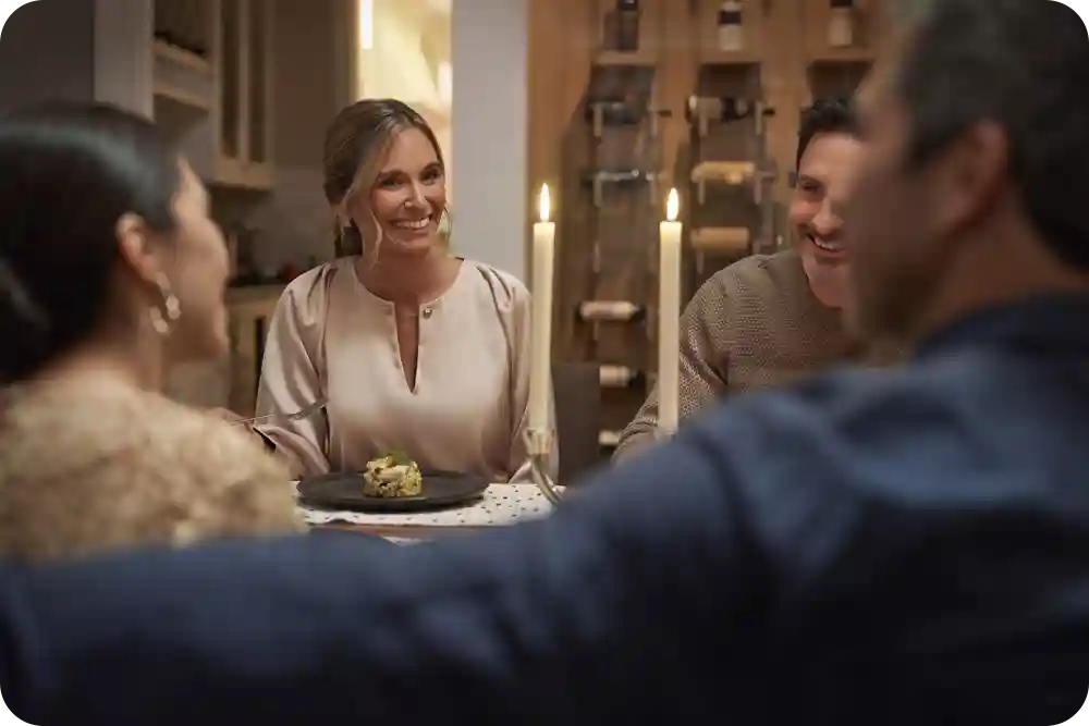 Photo of a family seated at a dinner table