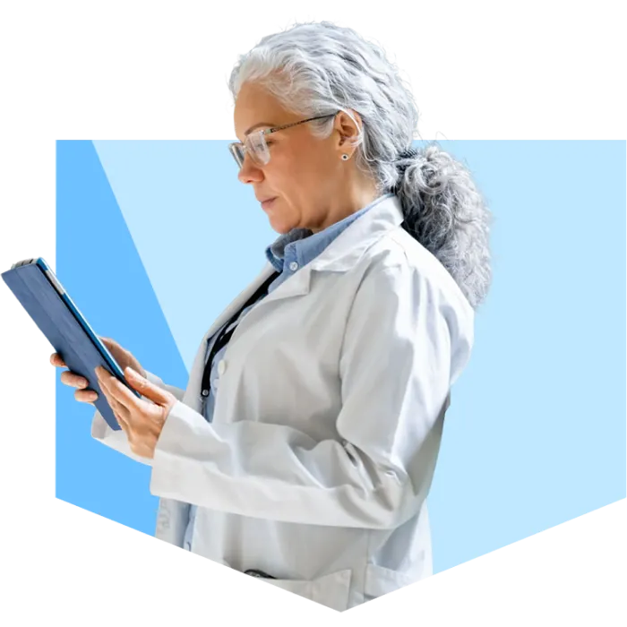 woman standidng reviewing tablet