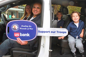 Woman smiling in her car
