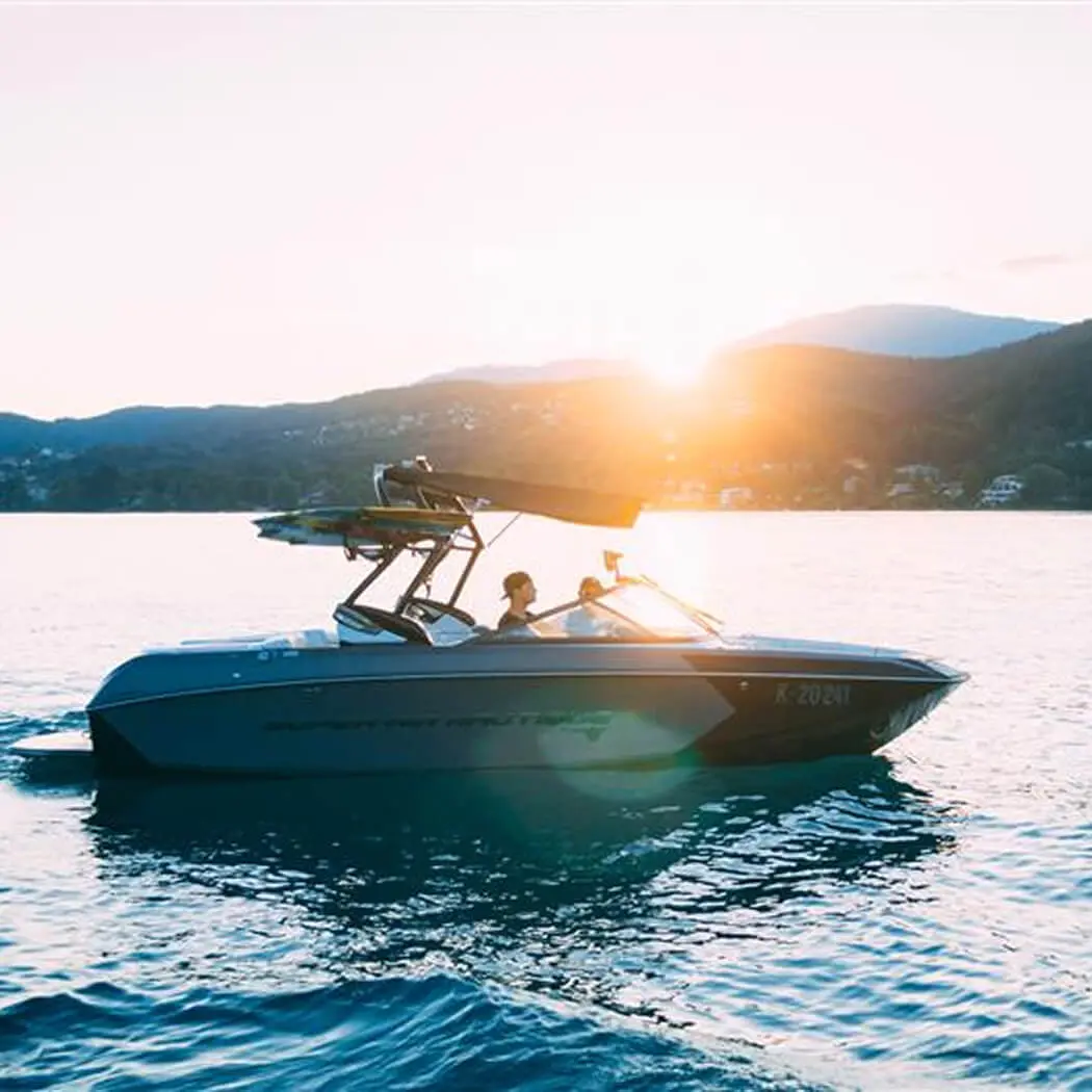 Couple driving a boat on a lake