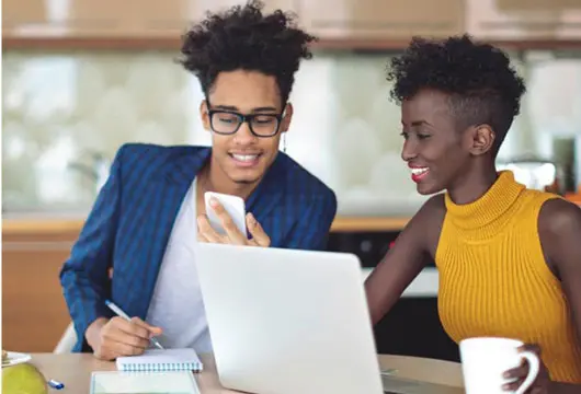 Two individuals comparing money market rates