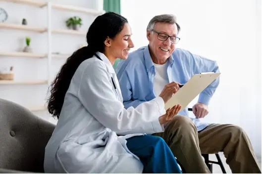 Doctor showing patient information on a chart