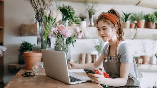 Business owner looking at a laptop