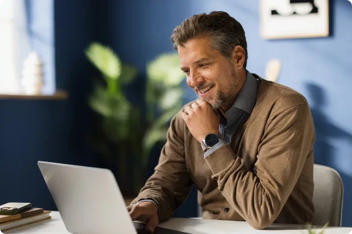 Person sitting at a desk using a laptop