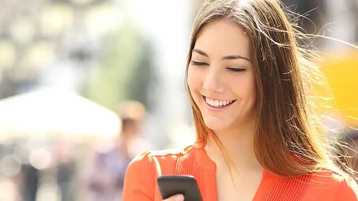 Person viewing checking account available balance on a smartphone