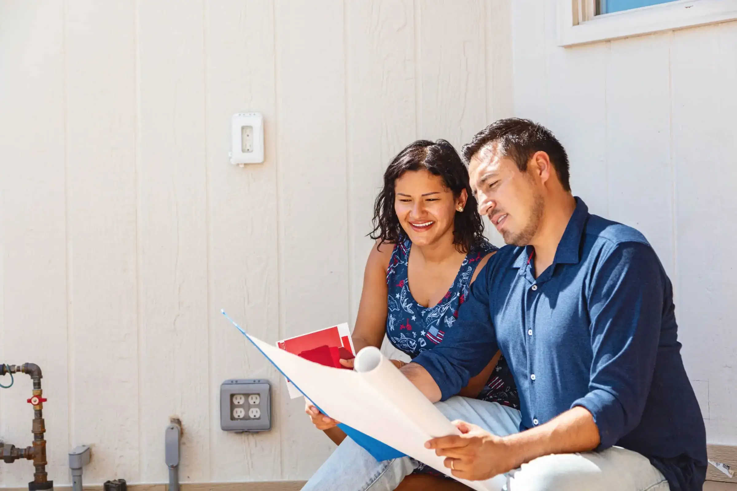 couple checking blueprint