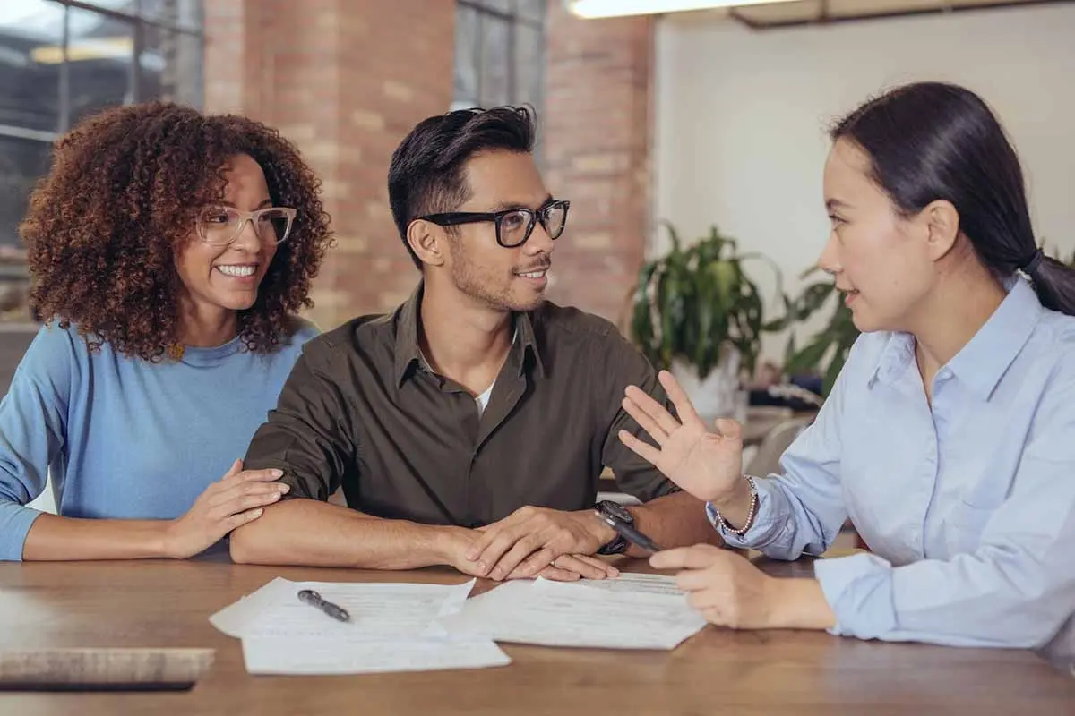 A woman discussing details with a mortgage loan officer.