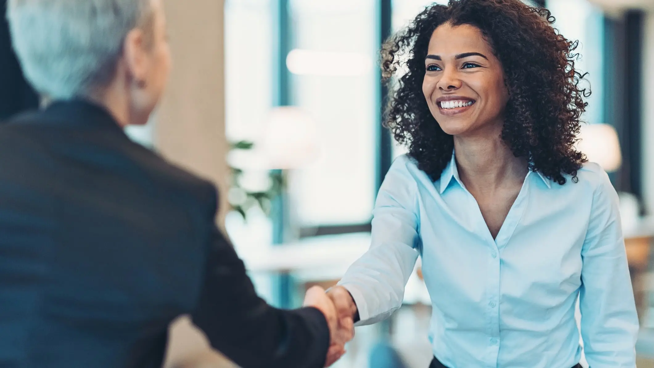 Man holding clipboard while working at desk