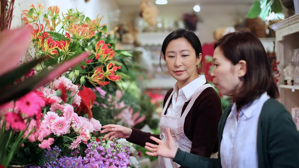 people checking flower