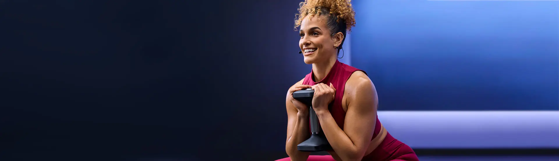 Professional fitness coach Jess Sims leads a weightlifting workout.