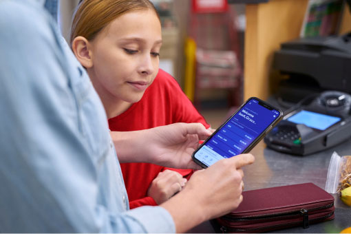 Photo of mother and daughter using the U.S. Bank mobile app