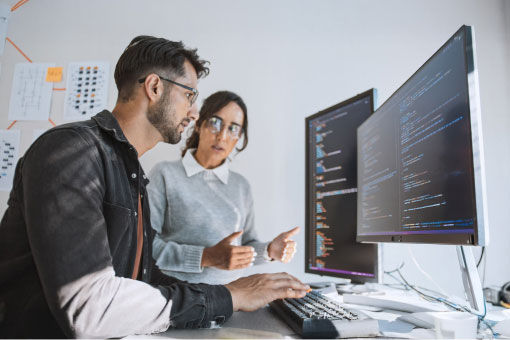 Photo of two coworkers collaborating