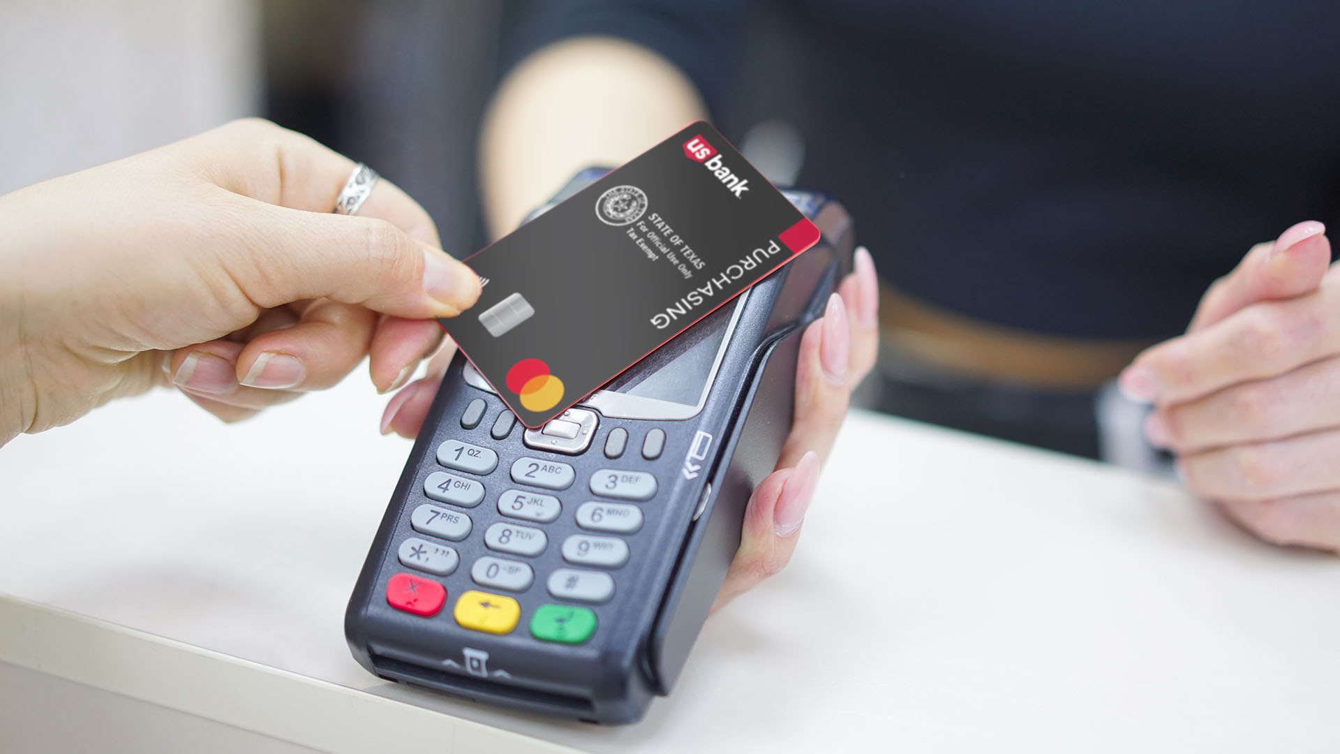 Image of the U.S. Bank Purchasing Card being used at a point of sale