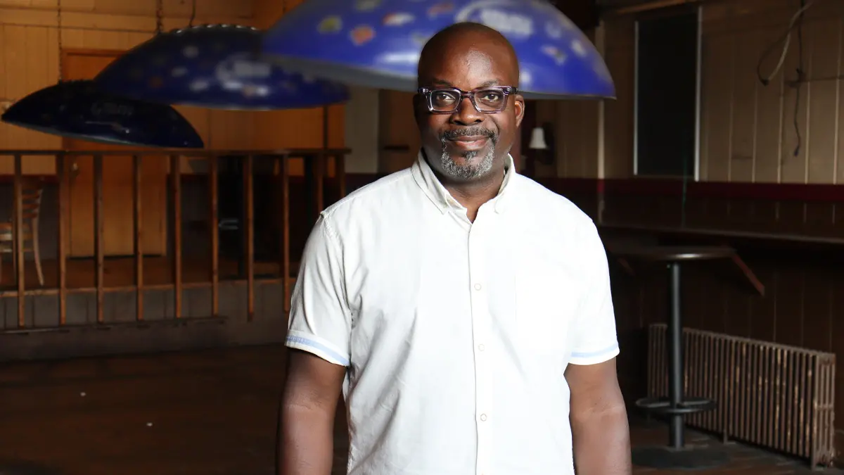 Man standing in empty bar