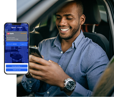 Image of man using Voyager mobile app in wihle parked in their car. 