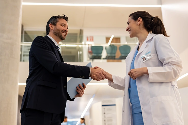 Office colleagues discussing cash flow and supply chain finance for healthcare.