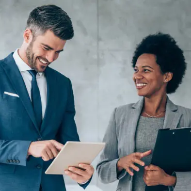Man using a tablet to do commercial financing real estate research