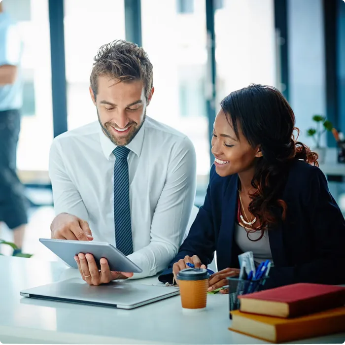 Image of Coworking reviewing tablet