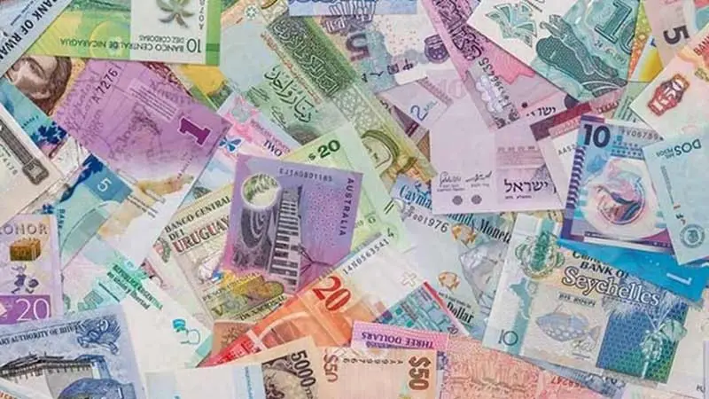 Photo of dozens of international paper currencies